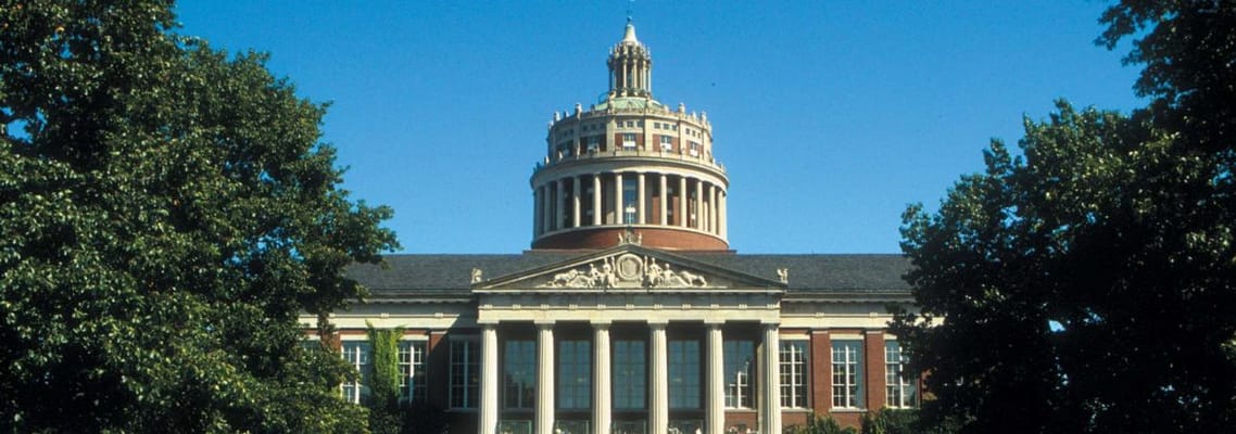Exterior view of a historic building surrounded by trees