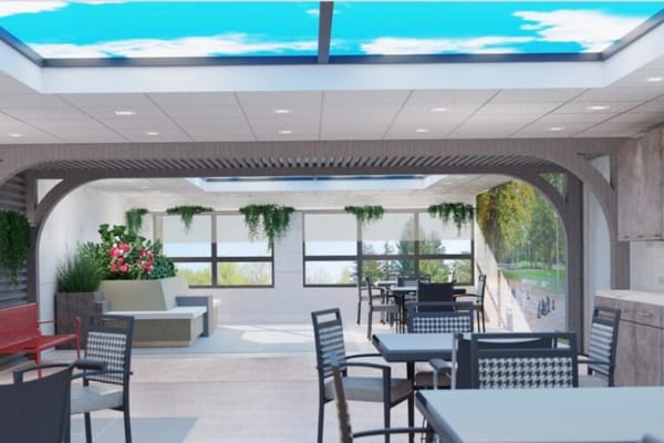 Bright common area with seating and plants