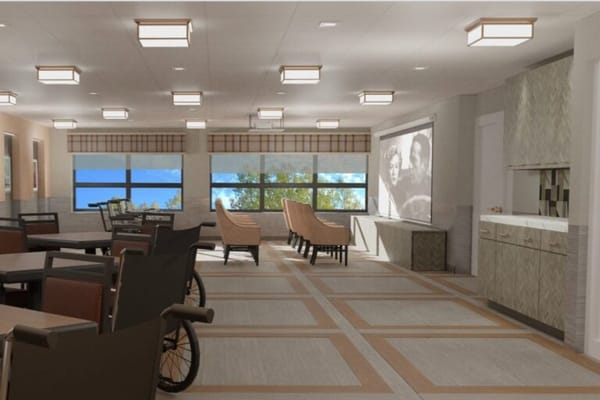 Bright common area with seating and windows