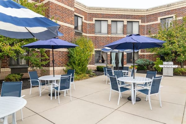 Outdoor patio area with tables and umbrellas