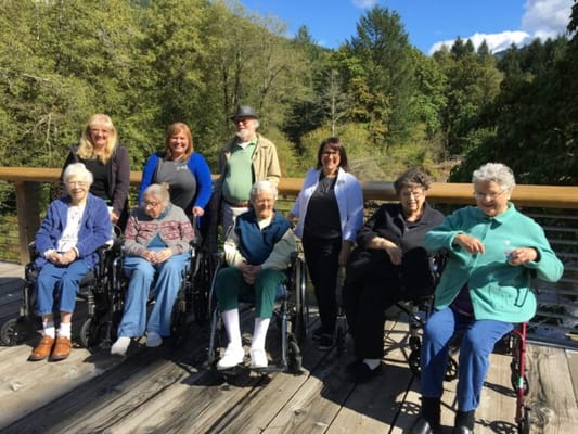 Group of residents and staff enjoying time outdoors