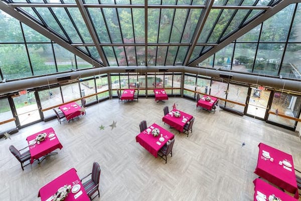 Bright dining room with tables set for meals