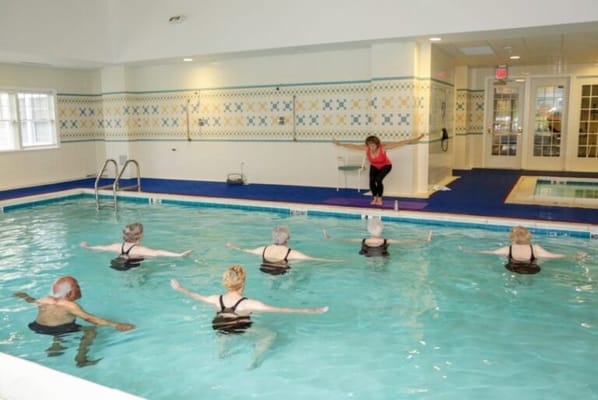 Residents participating in a water aerobics class