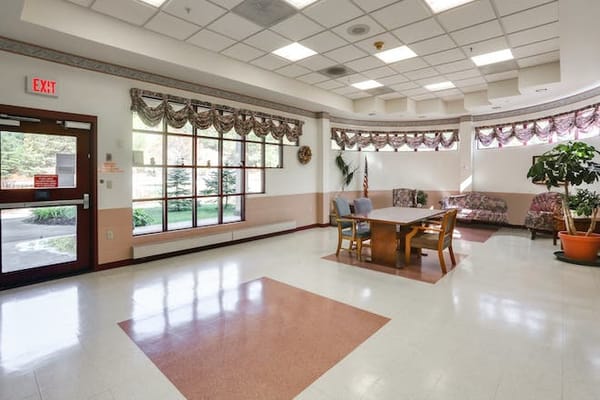 Bright common area with seating and large windows