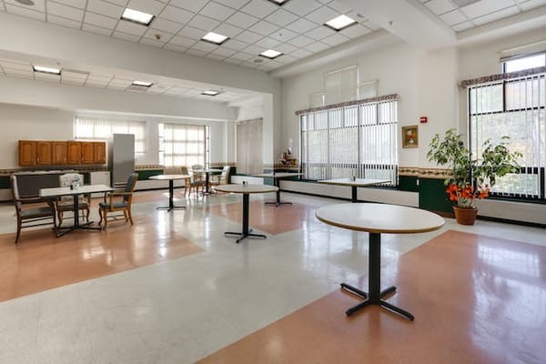Bright common area with tables and chairs