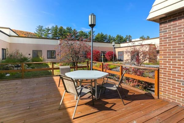 Outdoor patio area with a table and chairs