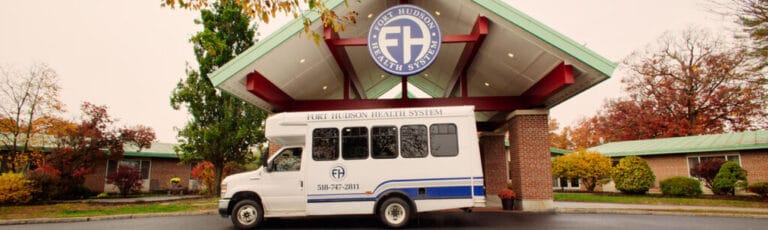 Facility transport vehicle in front of the building