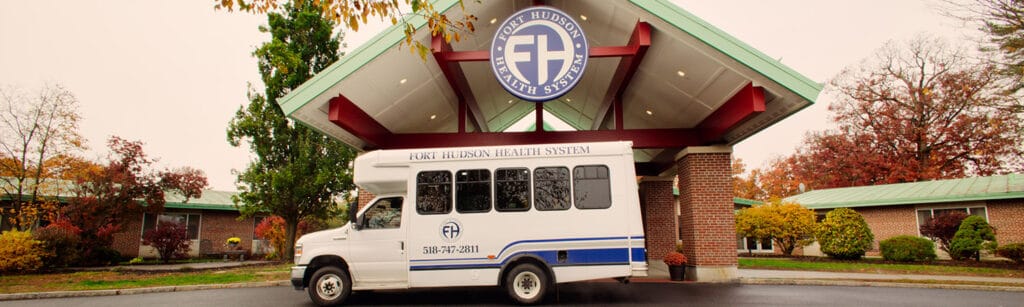 Facility transport vehicle in front of the building