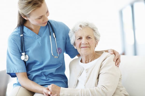 Caregiver interacting with a senior resident