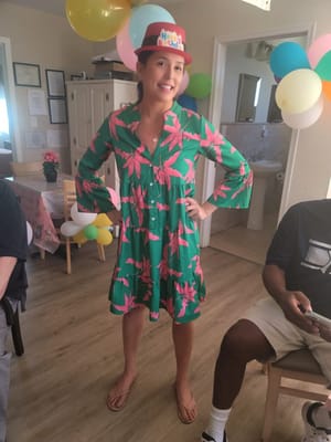 A staff member celebrating a birthday in a festive setting