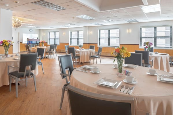 Bright dining area with tables set for meals