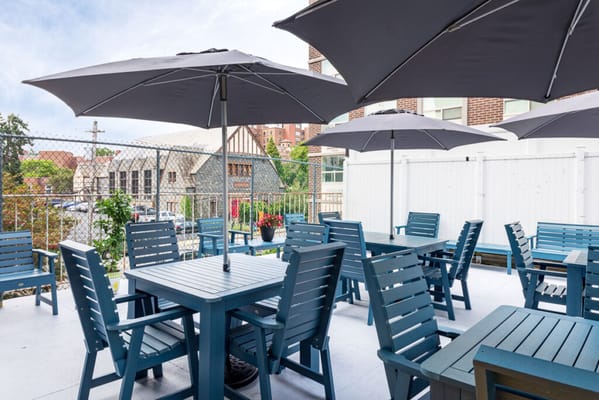 Patio area with outdoor seating and umbrellas