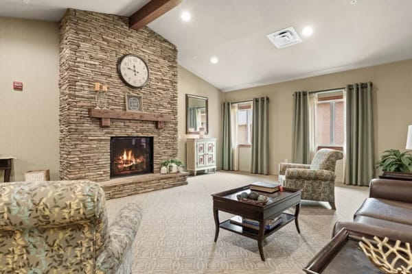 Warm interior lounge area with a fireplace