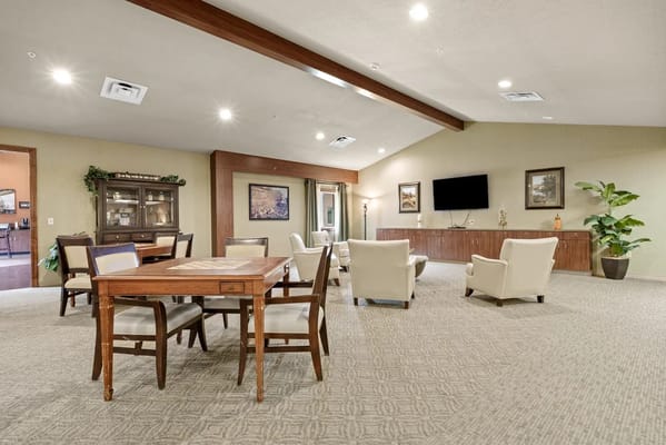 Bright common area with seating and a table