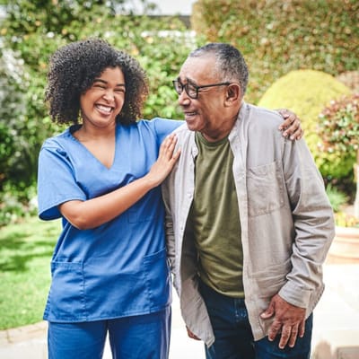 Caregiver and resident enjoying a moment outdoors