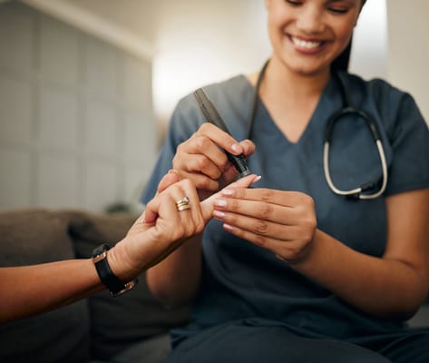 A caregiver providing nail care to a resident