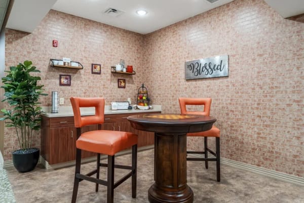 Cozy interior lounge with orange chairs and decor