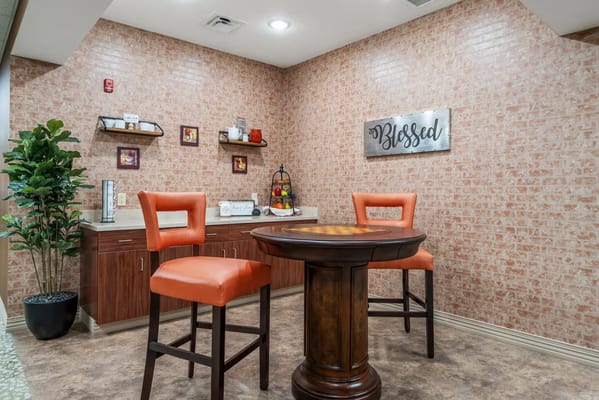 Cozy interior lounge with orange chairs and decor