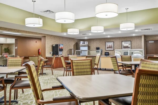 Bright dining area with tables and chairs