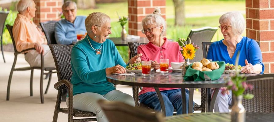 Residents enjoying a meal on the patio