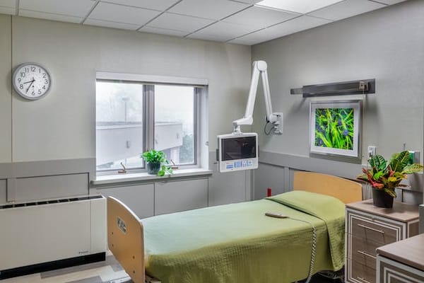 A private resident room with a hospital bed and view