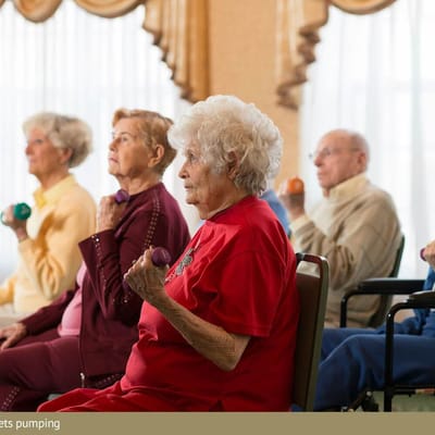 Residents participating in an exercise class with weights