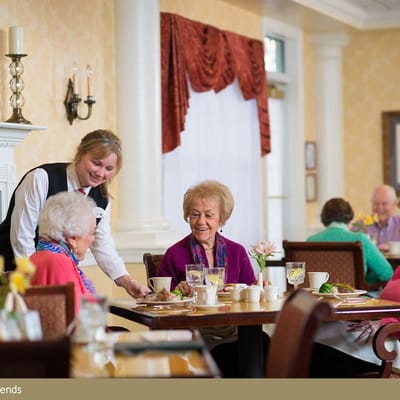 Residents enjoying a meal in the dining area