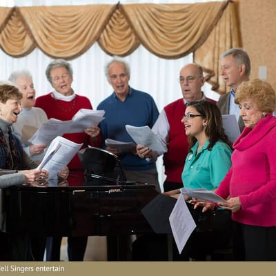 Residents singing together in a common area