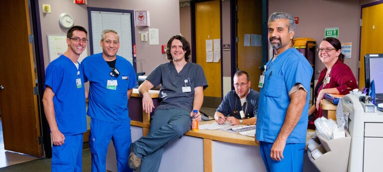Staff members smiling at the reception area