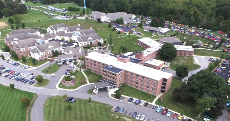 Aerial view of a senior living facility surrounded by nature