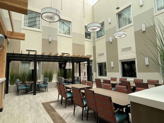 Interior common area with seating and natural light