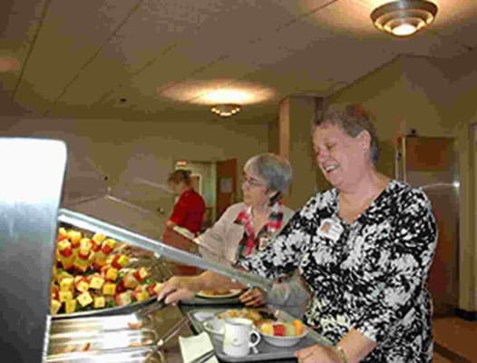 Residents enjoying a meal at the dining area