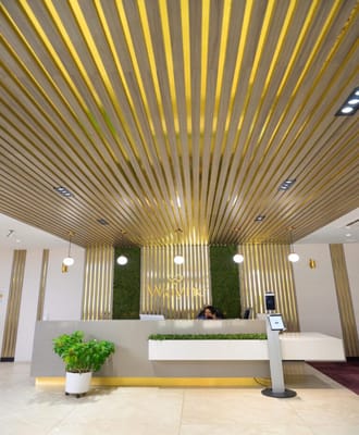 Modern reception area with indoor greenery and stylish decor