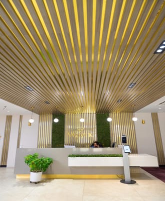 Modern reception area with indoor greenery and stylish decor