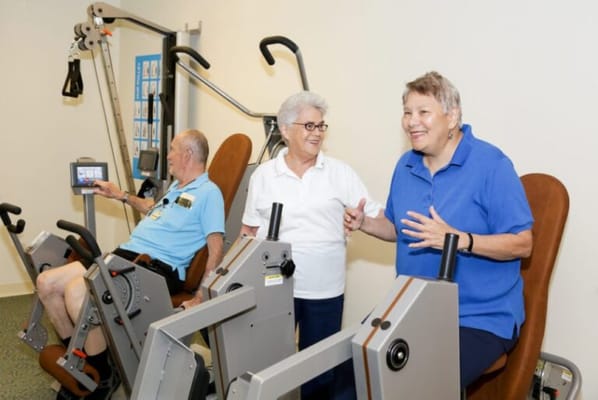 Residents engaging in physical activity on exercise machines