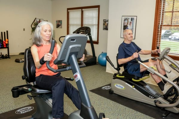 Residents exercising in the fitness room