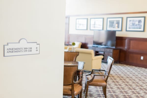 Interior view of a lounge area with signage
