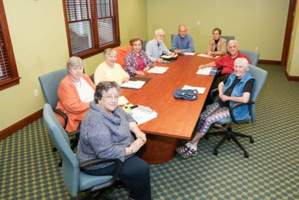 Residents participating in a group activity at a table