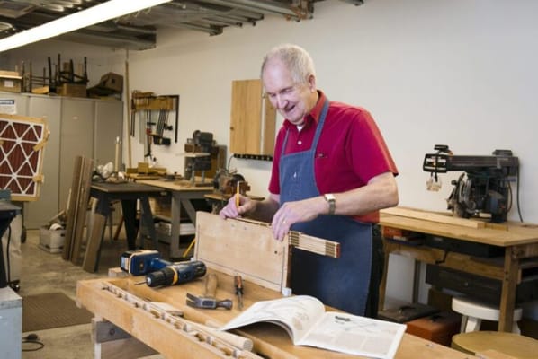 Senior resident engaging in woodworking activity