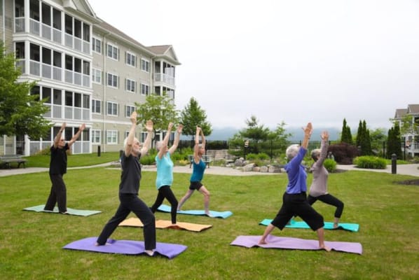 Residents participating in outdoor yoga class