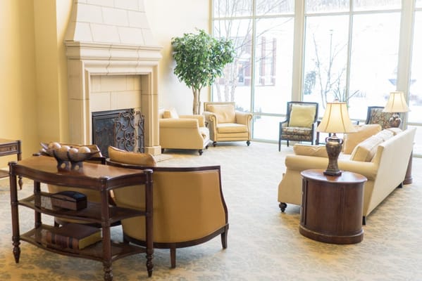 Comfortable lobby area with seating and fireplace