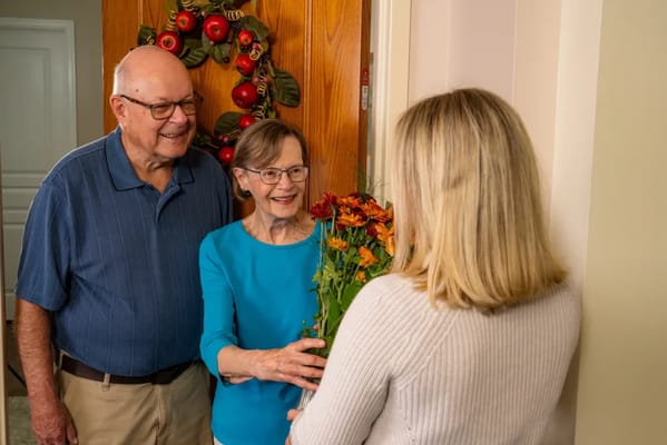 Seniors receiving flowers at their door