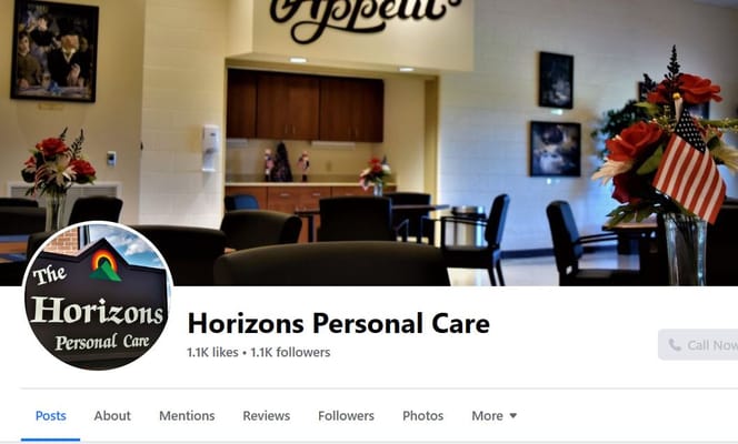 Bright common area with tables and flowers