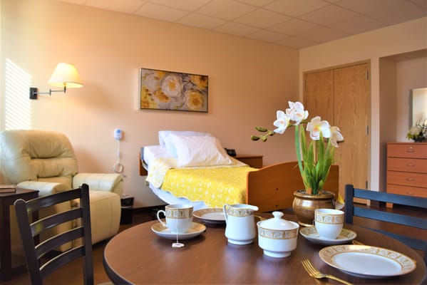Cozy resident room with tea set and floral decor