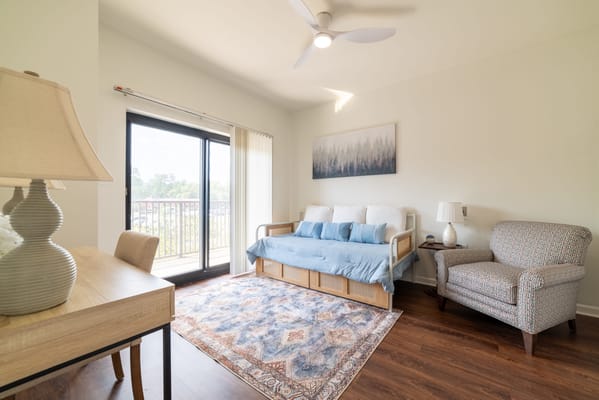 Cozy resident room with seating and natural light
