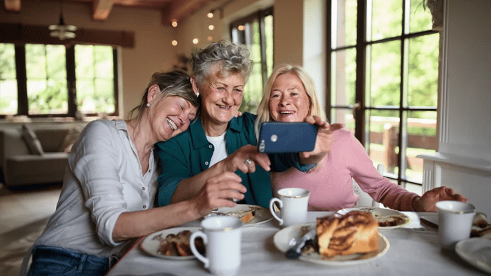 Residents enjoying coffee and dessert while taking a selfie
