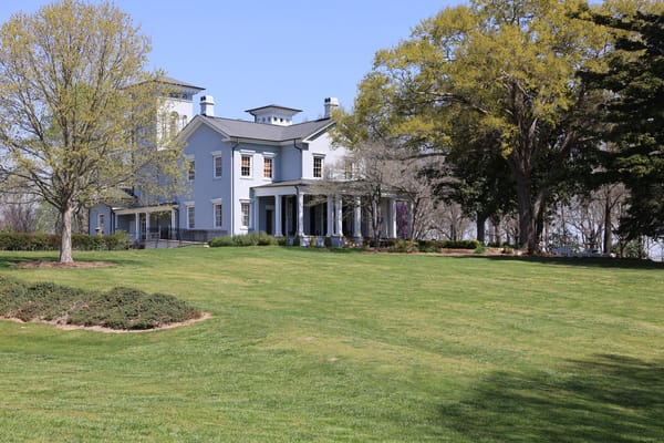 Exterior view of a senior living facility with landscaped grounds
