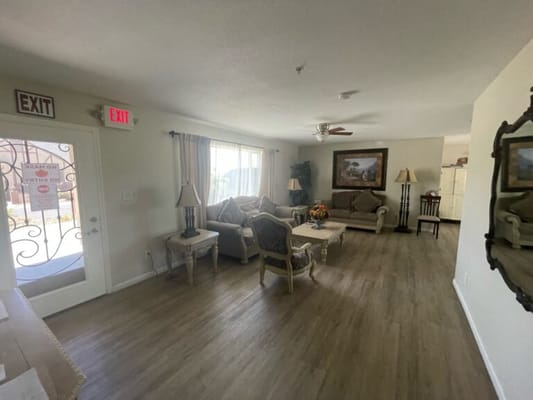 Cozy lounge area with seating and exit sign