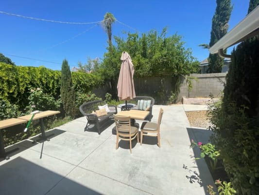 Outdoor seating area with tables and chairs