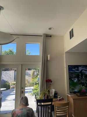 Resident in a cozy common area with outdoor view